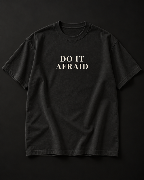 DO IT AFRAID black tee photographic mockup with complete cream serif print