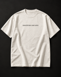 GRATITUDE AND LOVE heavyweight tee with small serif chest print