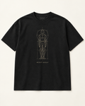 The Blueprint heavyweight tee in near-black with a muted gold blueprint linework figure and BUILT DAILY caption.
