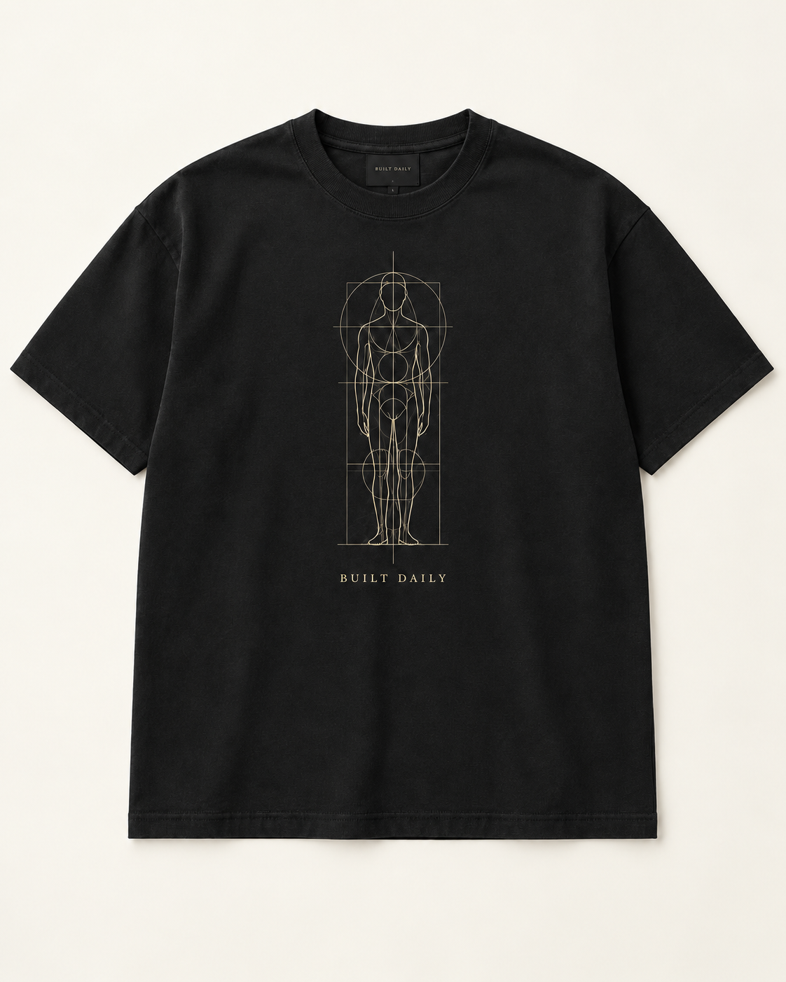 The Blueprint heavyweight tee in near-black with a muted gold blueprint linework figure and BUILT DAILY caption.