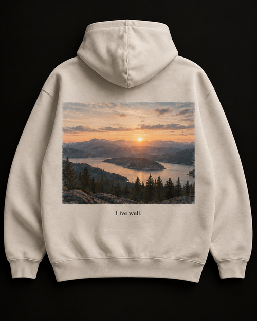 The Horizon heavyweight hoodie in bone with a sunrise back print and Live well. caption.