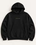 The Signature heavyweight hoodie in near-black with FRAMEWORK embroidered in muted gold on the chest.