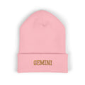 The Zodiac Beanie, Gemini, old gold thread, baby pink beanie